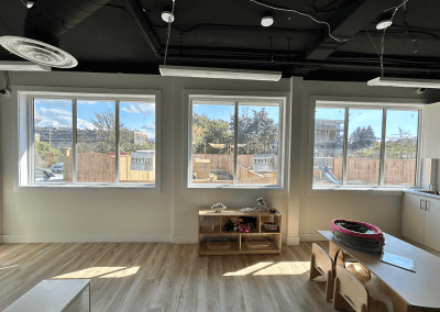 Spacious, well-lit classroom perfect for early childhood education and play activities.