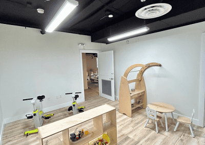 Bright, welcoming childcare room with play and learning areas.