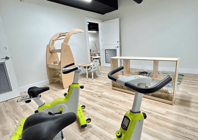 Modern indoor fitness bike equipment for kids at The Learning Circle Childcare. Bright, clean, and engaging space for young children.